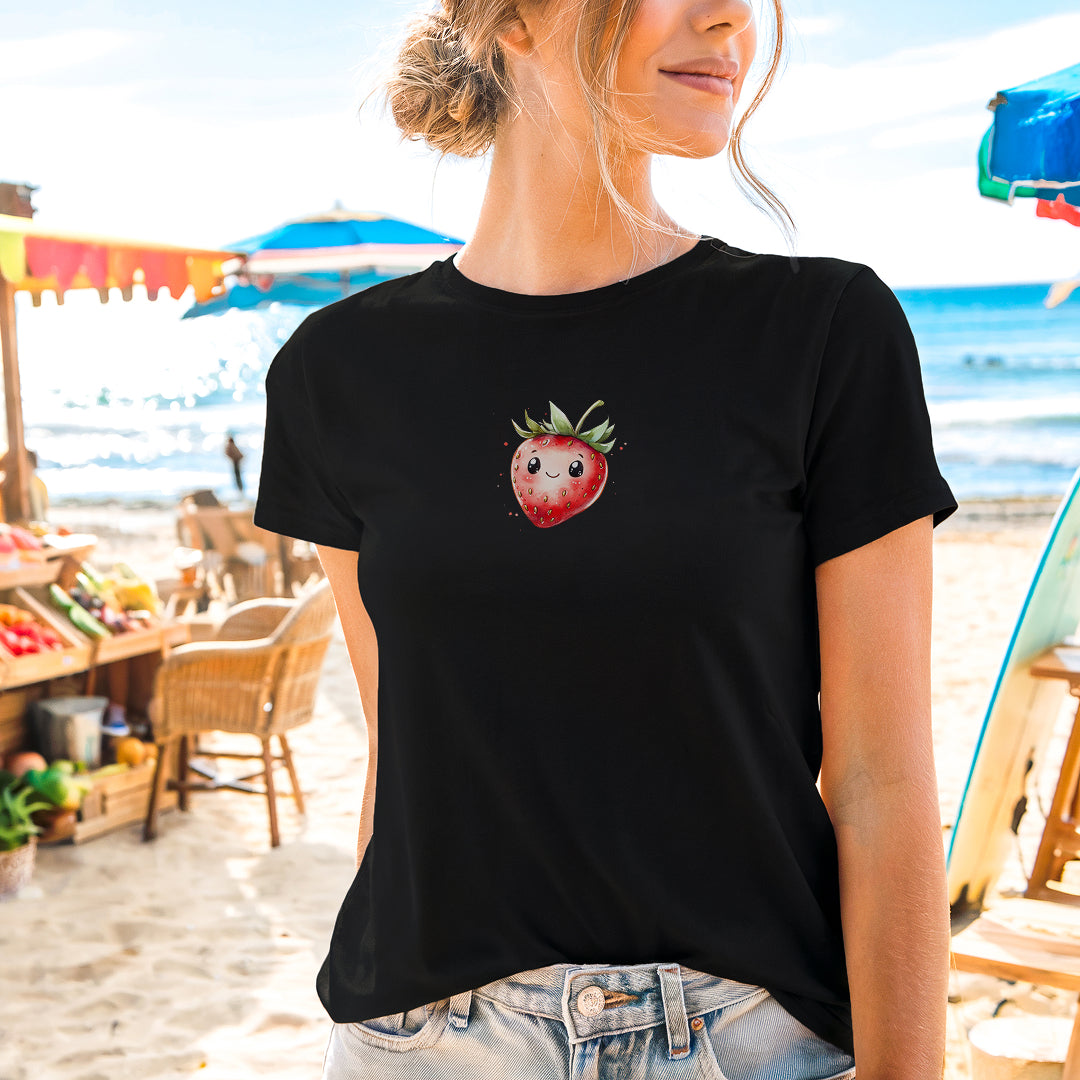 a woman wearing a black shirt with a strawberry on it
