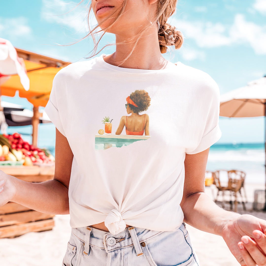 a woman standing on a beach holding a plate of food