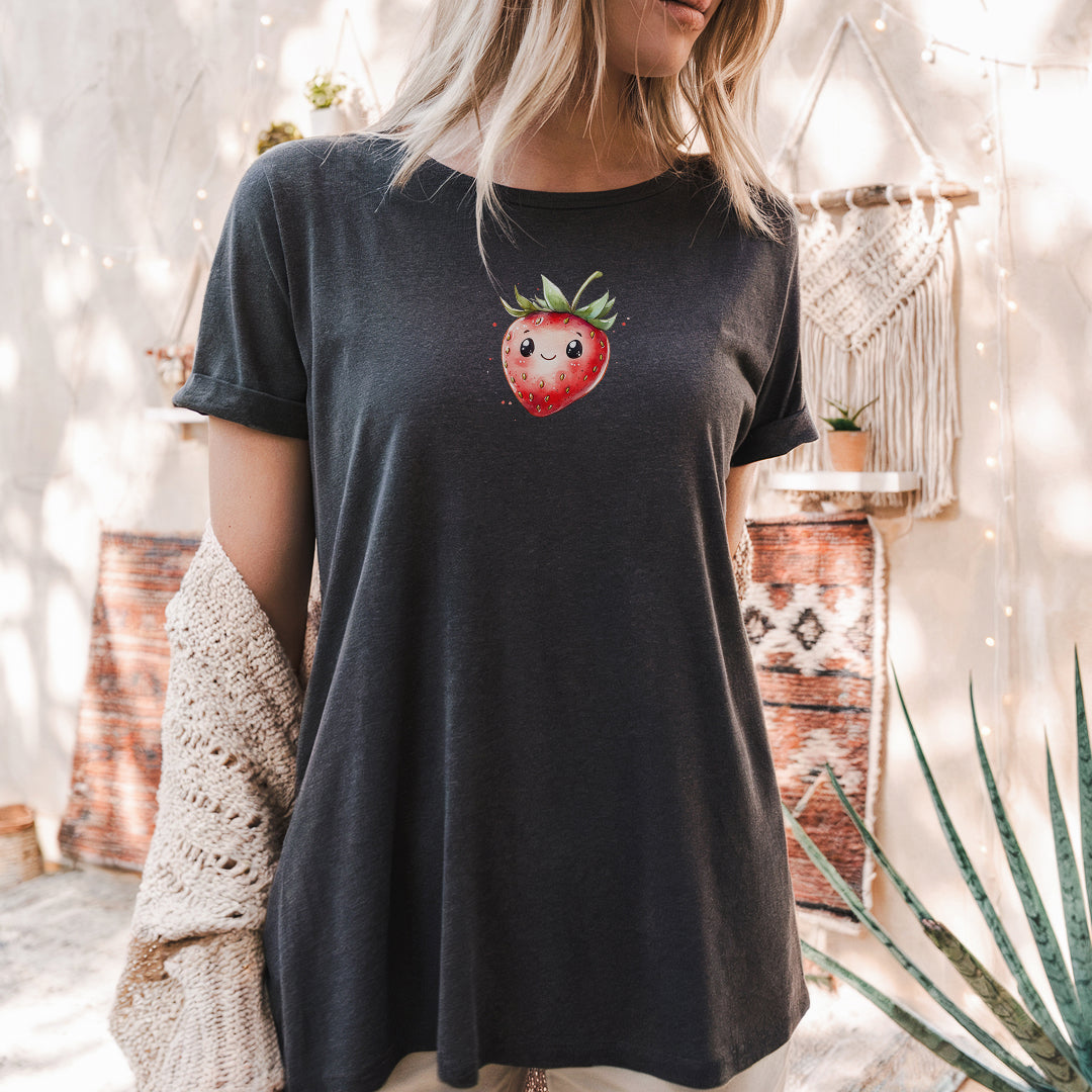 a woman wearing a black shirt with a strawberry on it