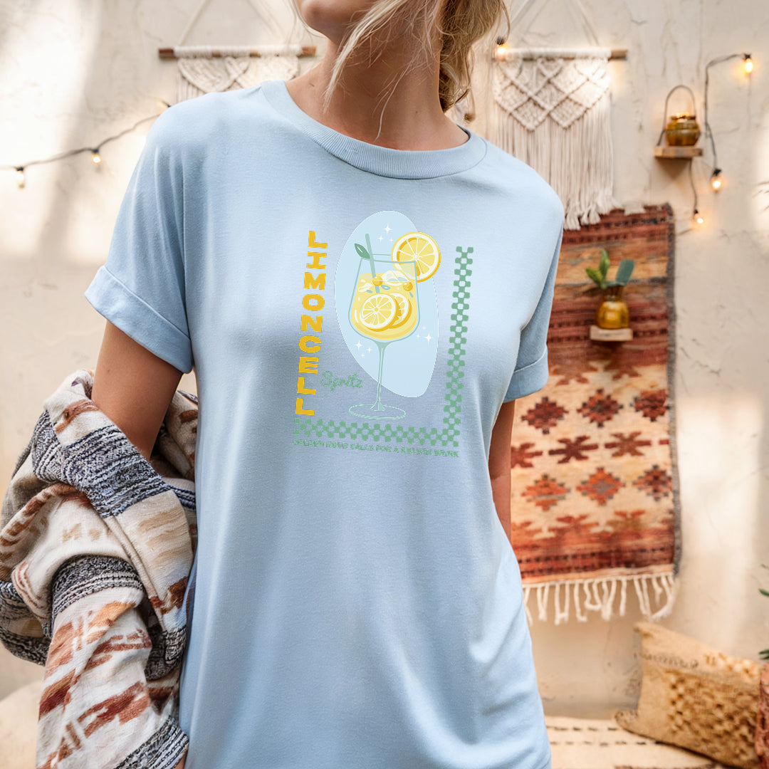 a woman wearing a blue shirt with a lemon on it