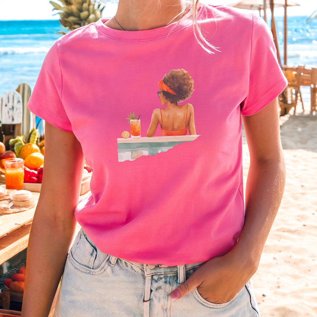 a woman wearing a pink shirt with a picture of a woman on it