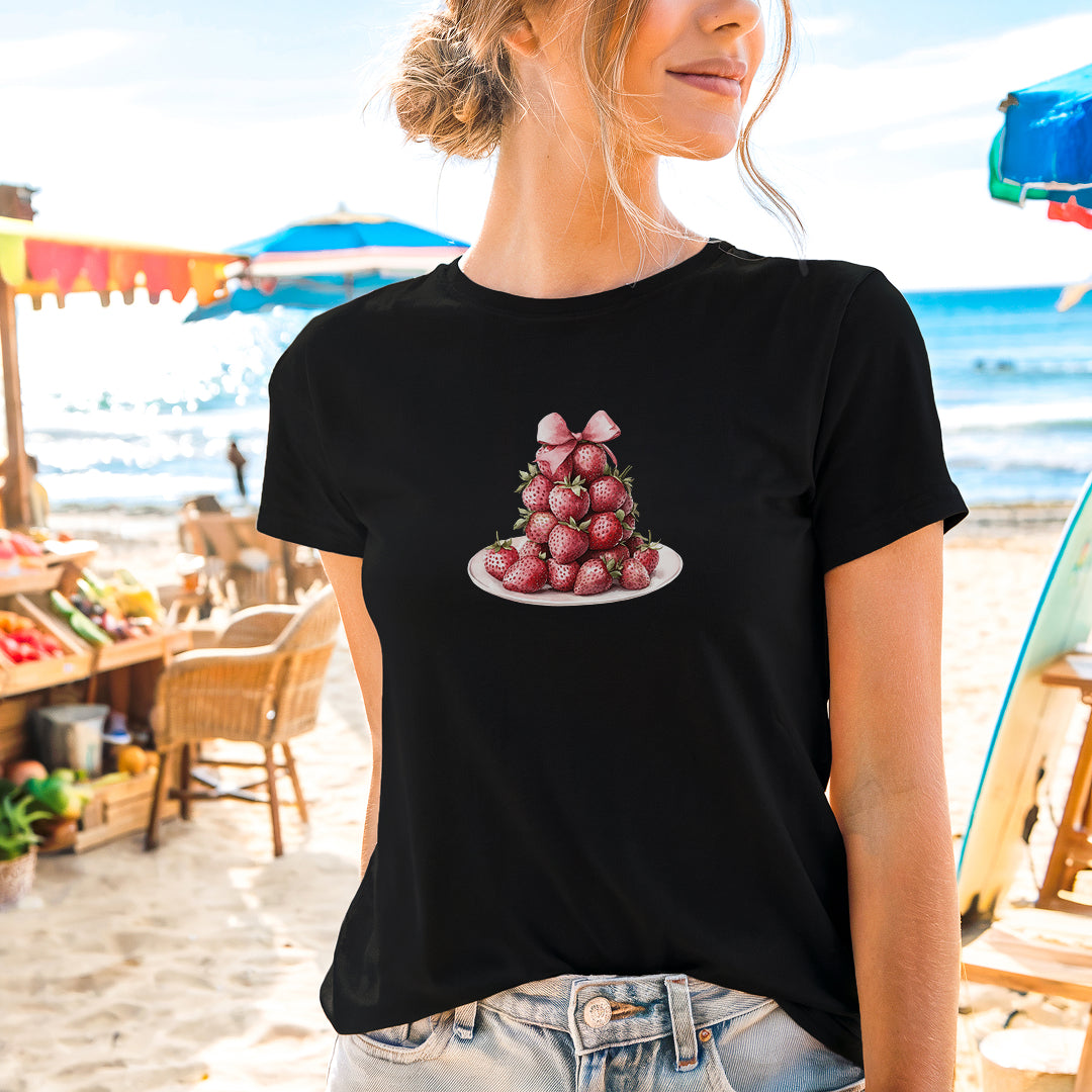 a woman wearing a black shirt with strawberries on it