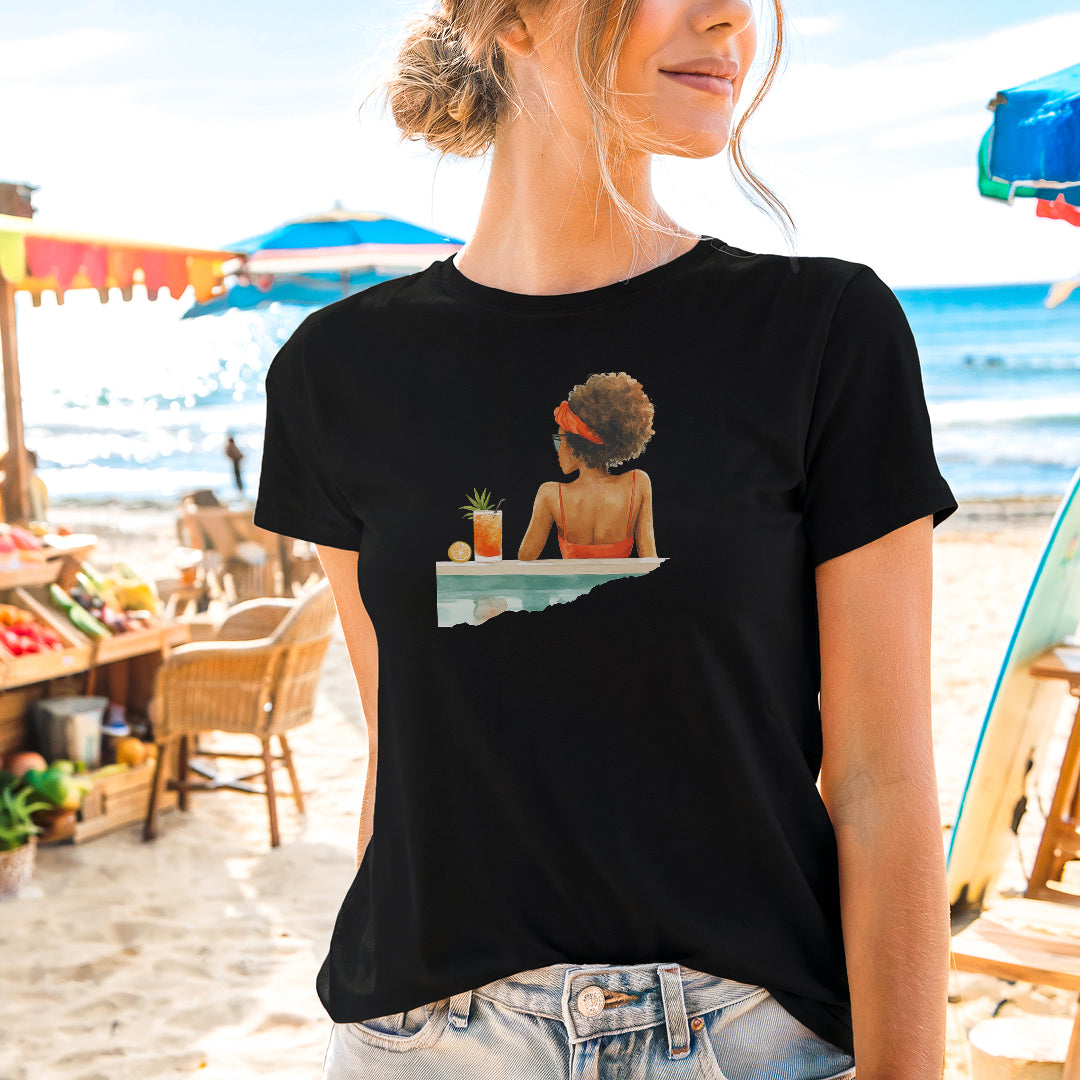a woman wearing a black shirt with a picture of a woman sitting at a table