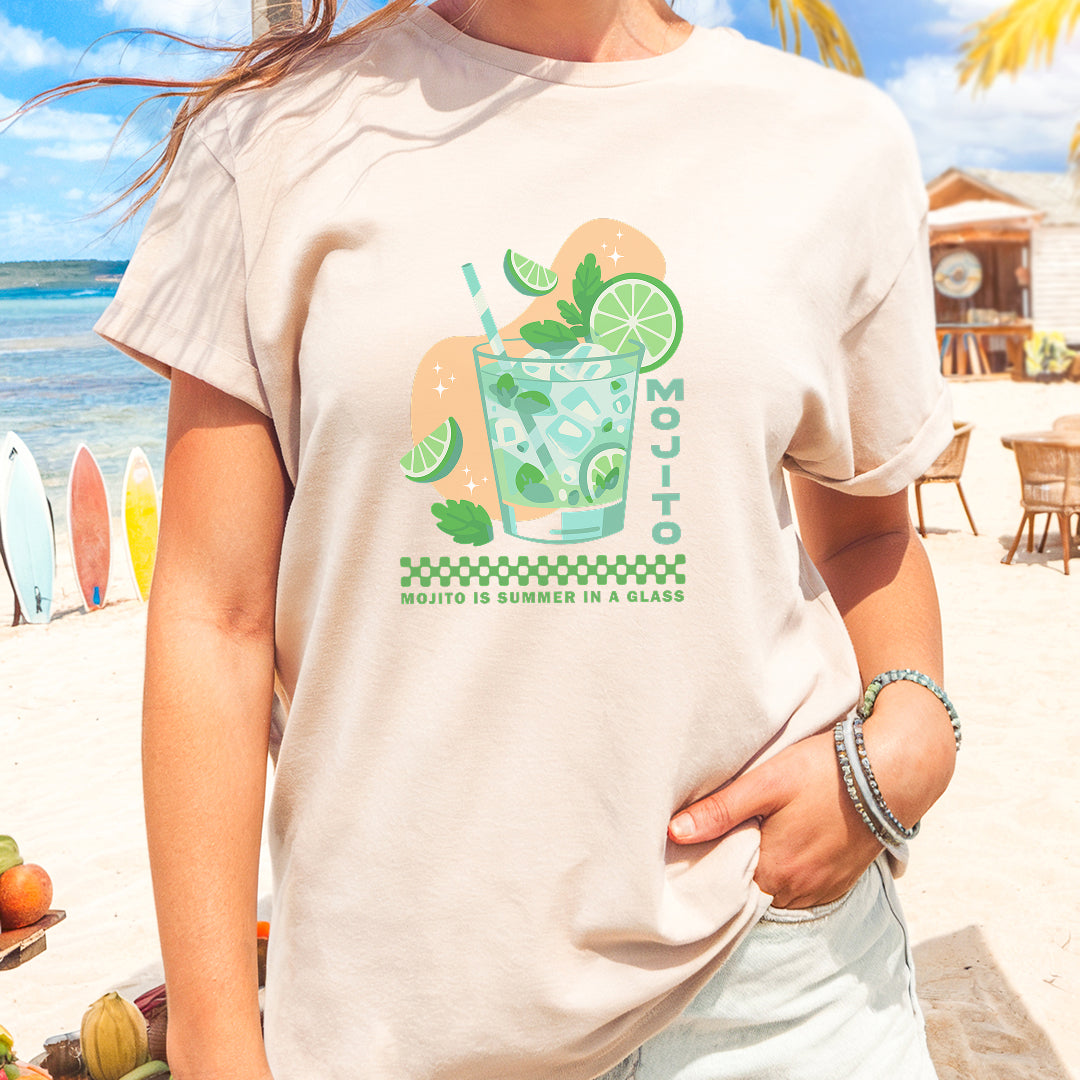 a woman standing on a beach with a drink in her hand