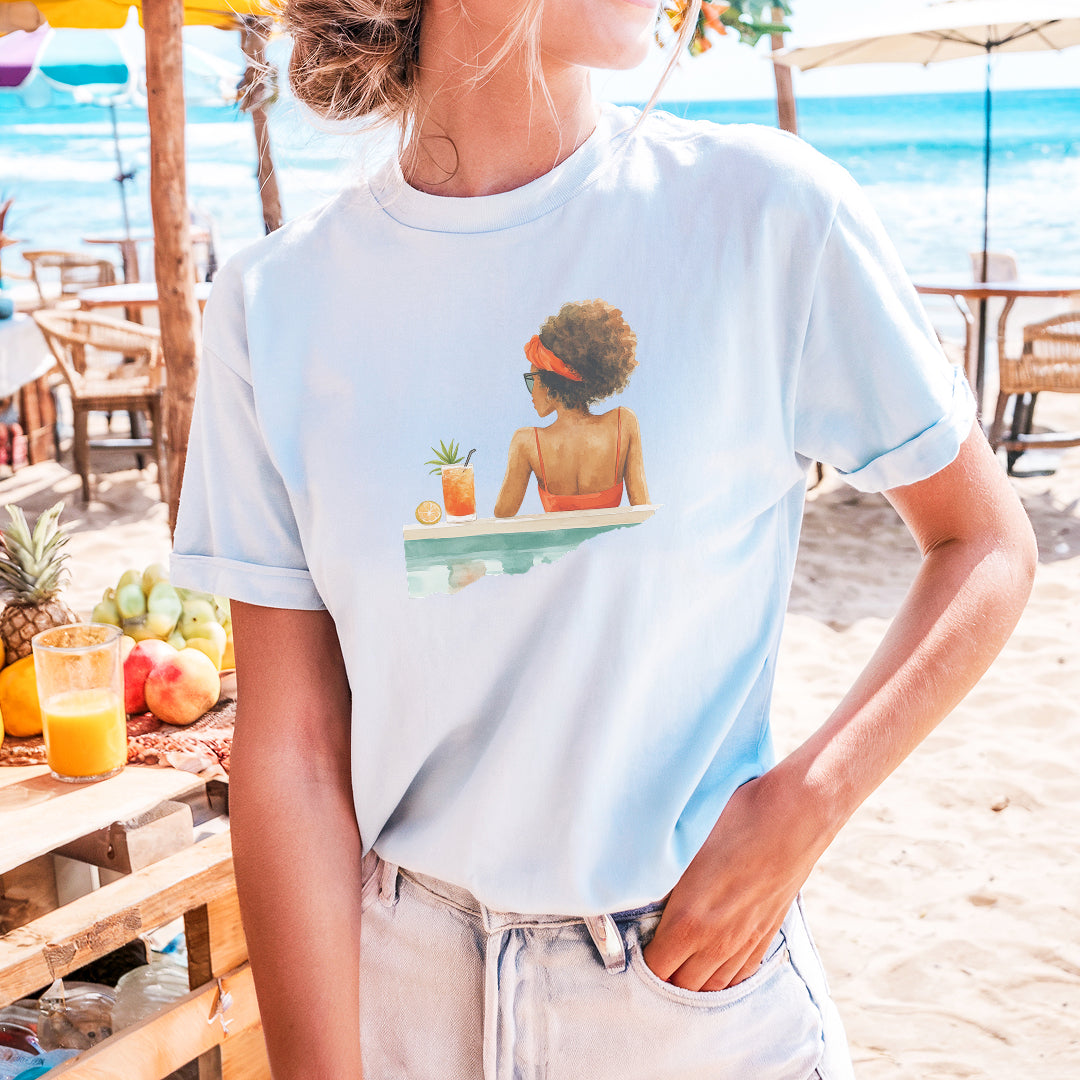 a woman wearing a t - shirt with a picture of a woman sitting on a