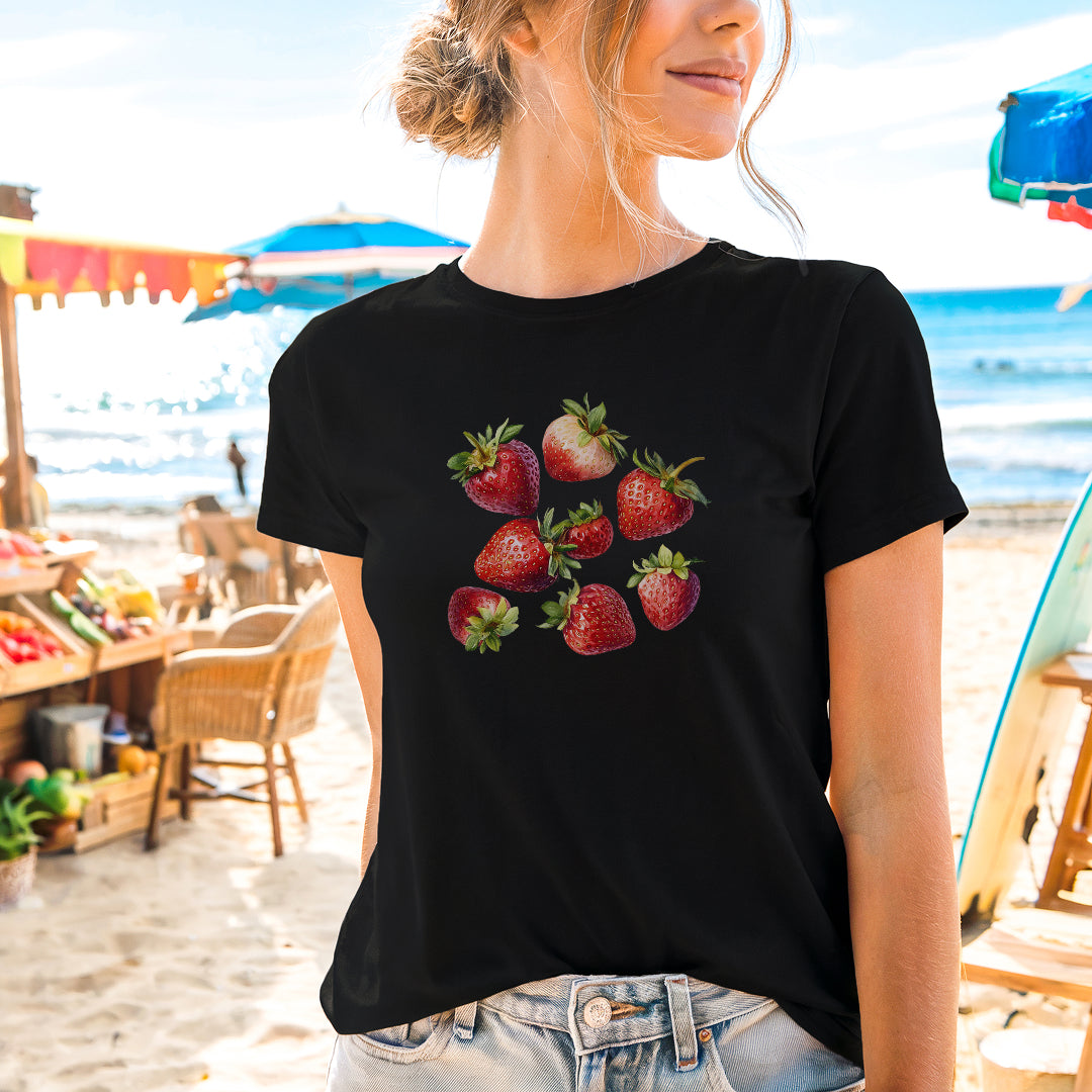 a woman wearing a black shirt with strawberries on it