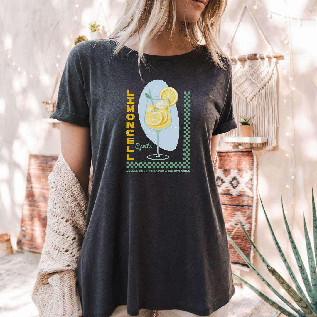 a woman wearing a black shirt with a picture of a lemon on it