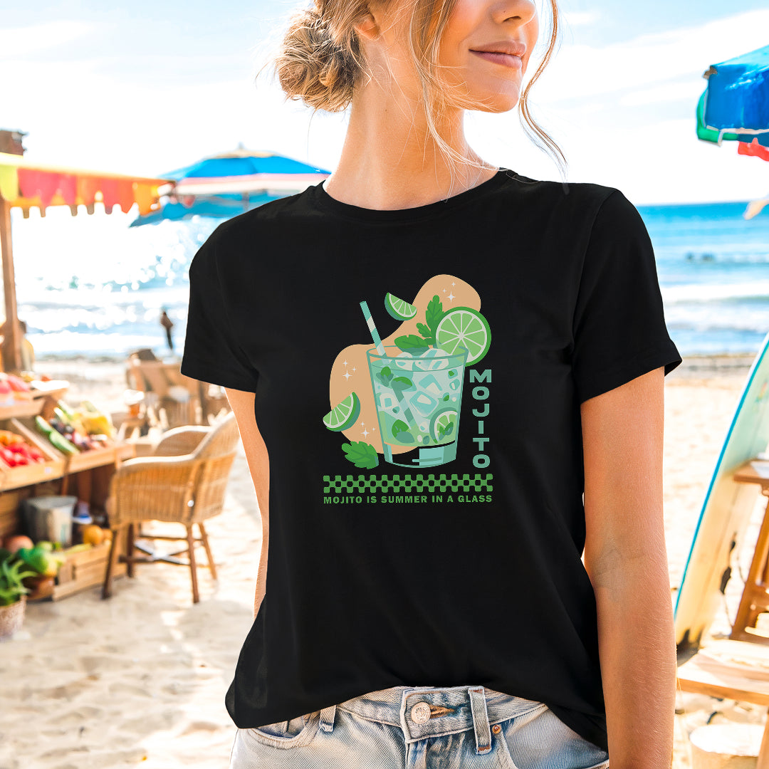 a woman standing on a beach wearing a black shirt