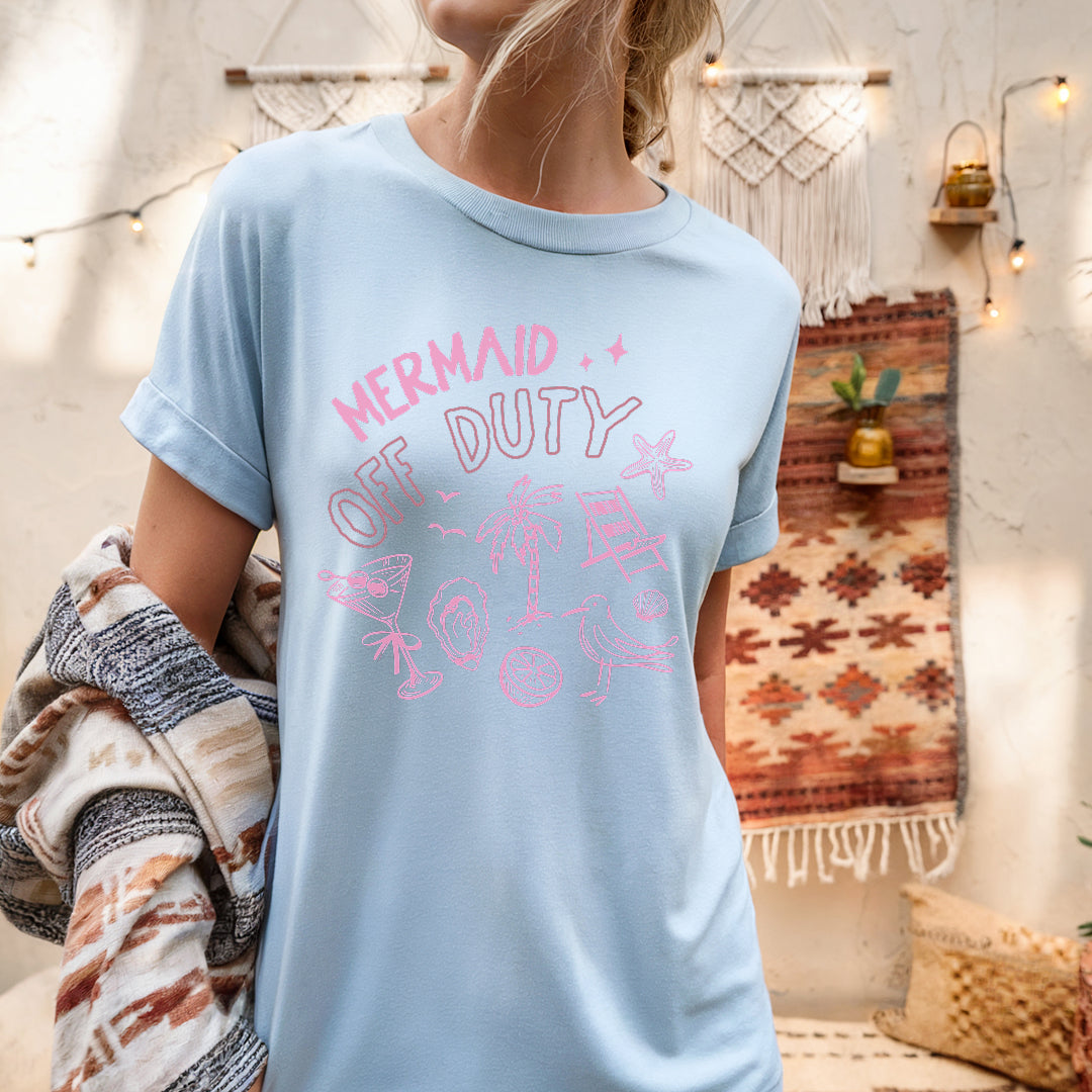 a woman wearing a mermaid of duty shirt