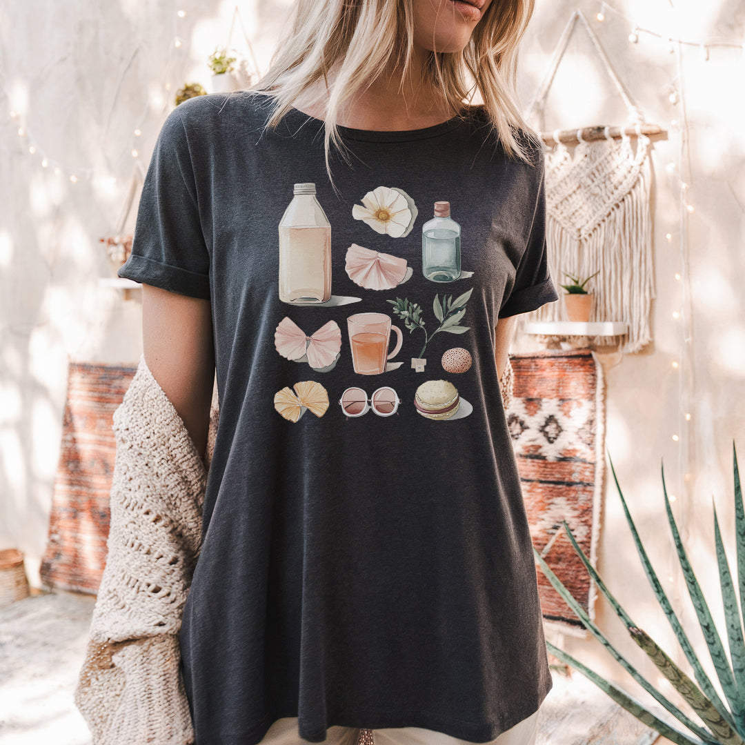 a woman wearing a t - shirt with shells on it
