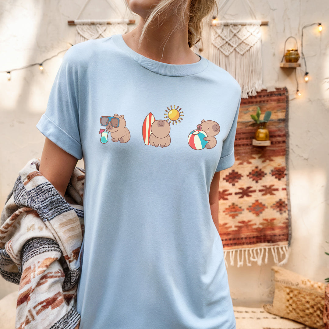 a woman wearing a blue shirt with three bears on it