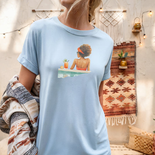 a woman wearing a blue shirt with a picture of a woman on it