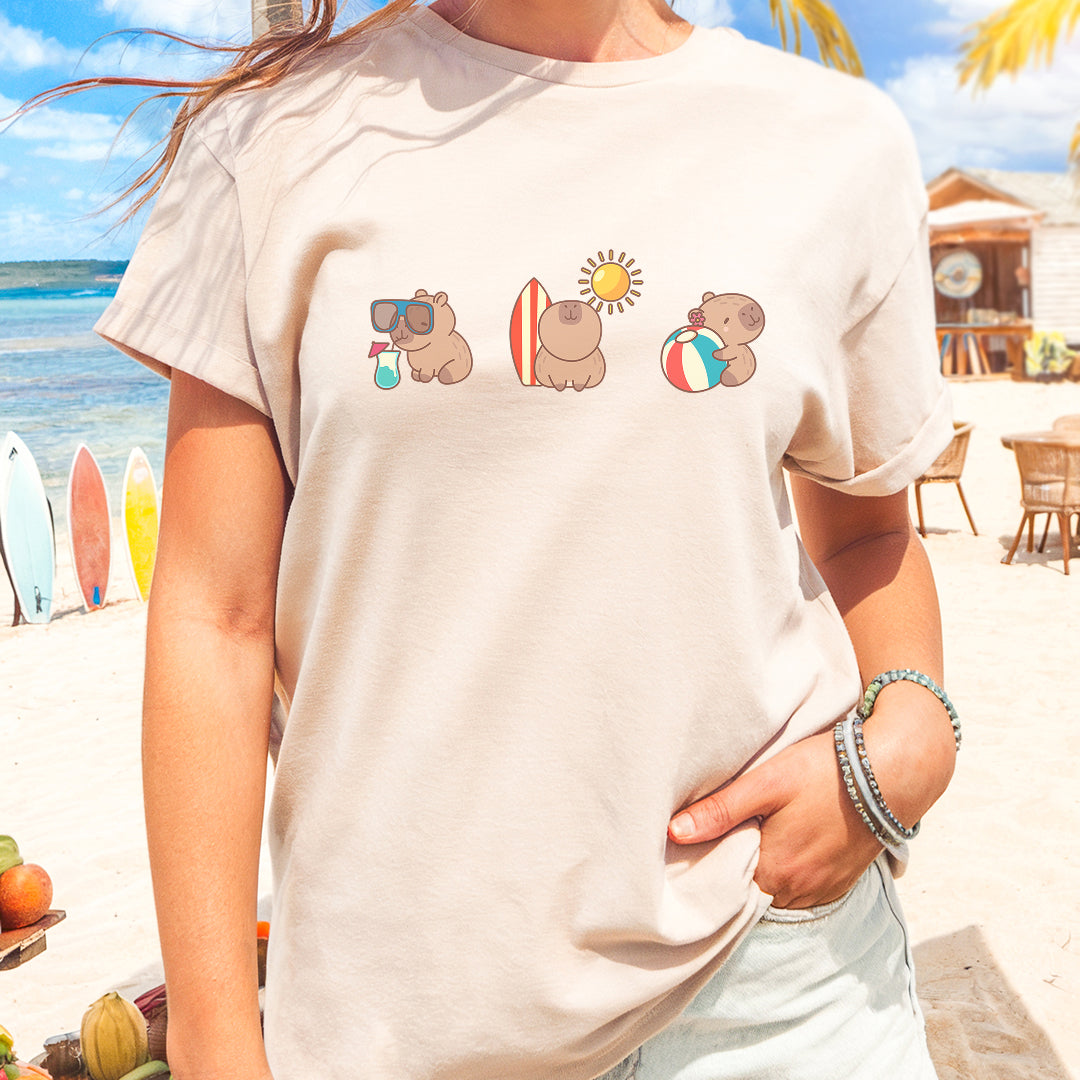 a woman standing on the beach with her hands in her pockets