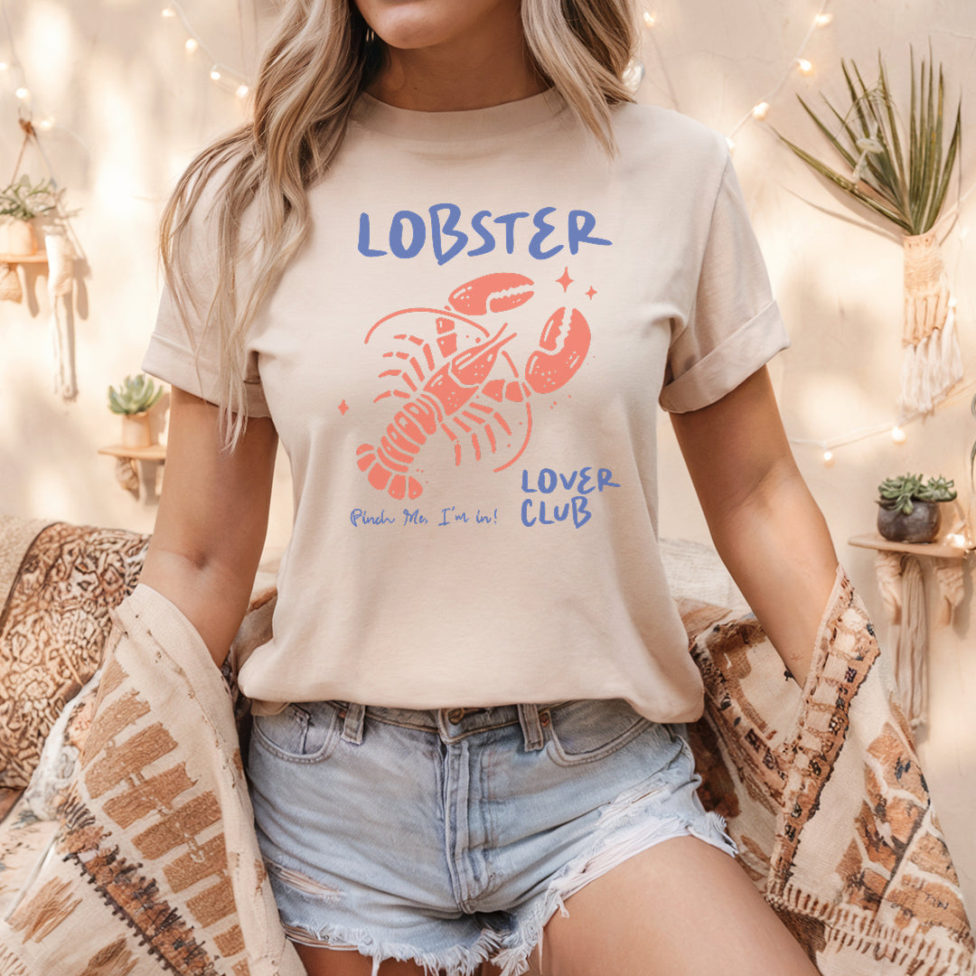 a woman wearing a lobster lover club t - shirt