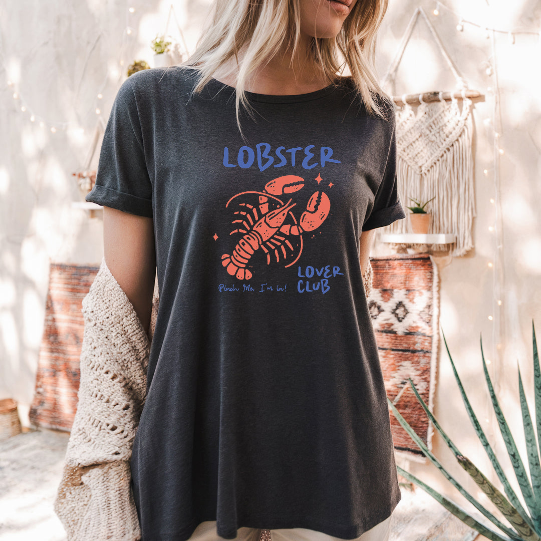 a woman wearing a black lobster t - shirt