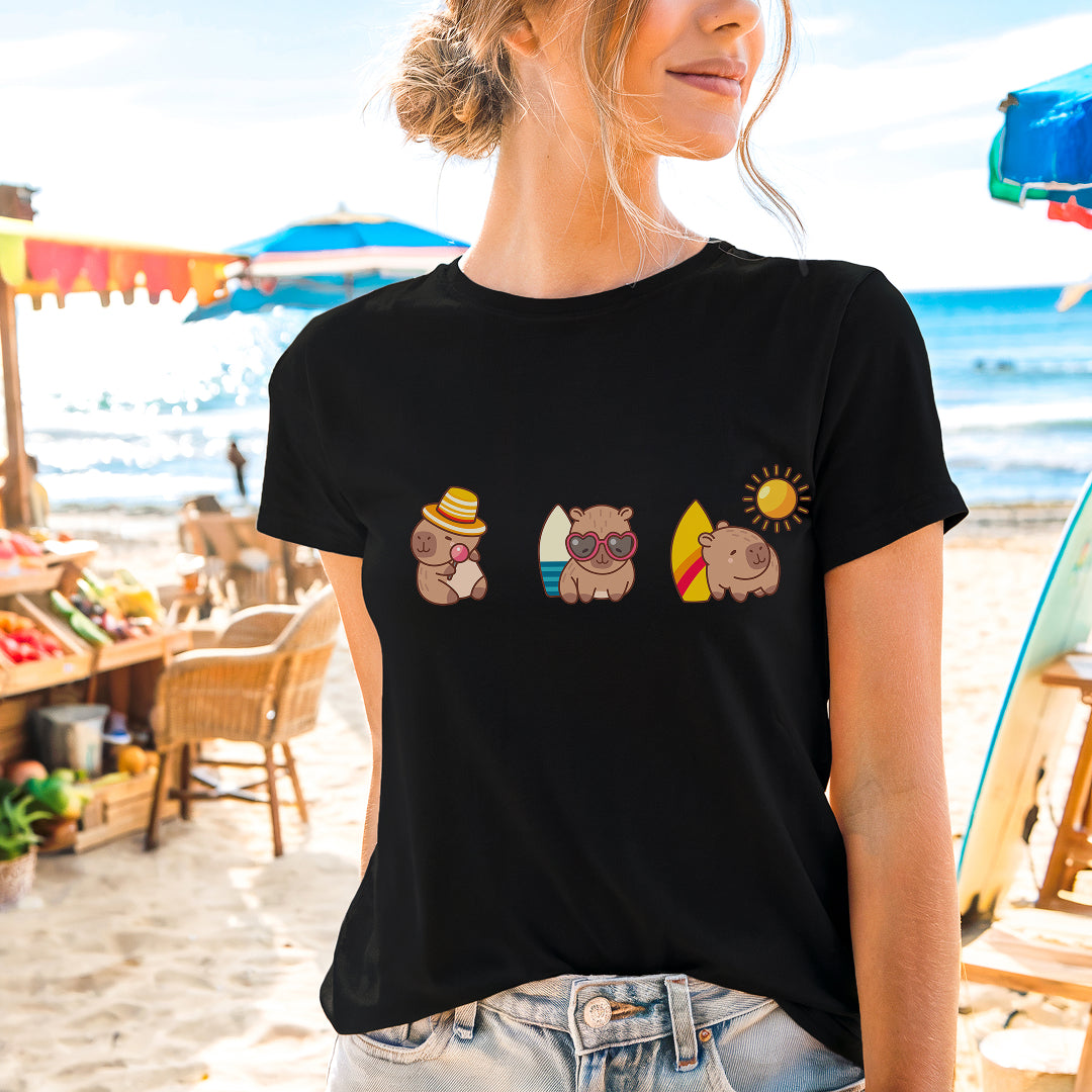 a woman standing on a beach wearing a black shirt