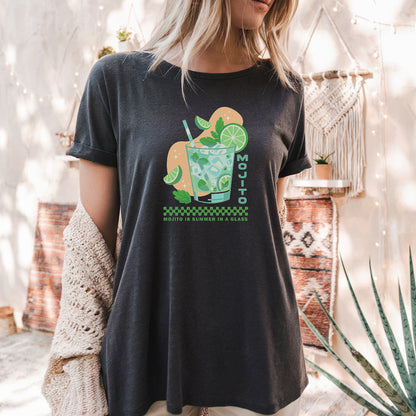 a woman standing in front of a cactus wearing a t - shirt