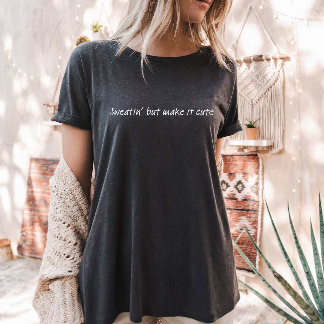 a woman wearing a black t - shirt that says sweet but make it cute