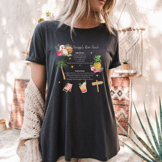 a woman wearing a black shirt with a cross and pineapples on it