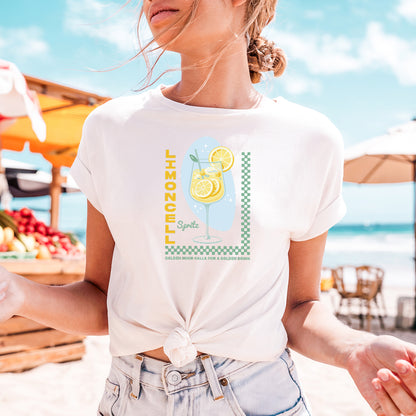 a woman standing on a beach holding a plate of food