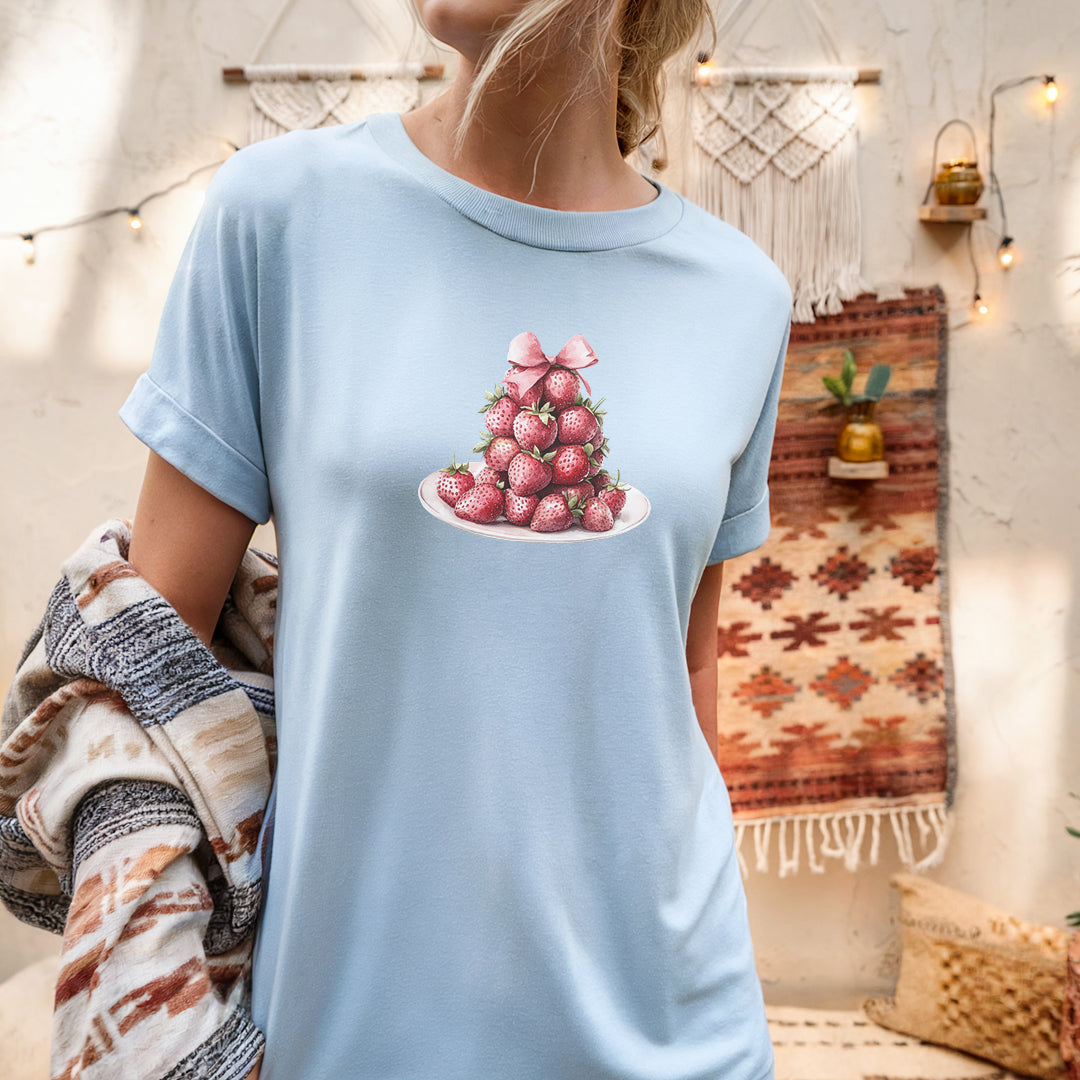 a woman wearing a blue shirt with a bunch of radishes in it