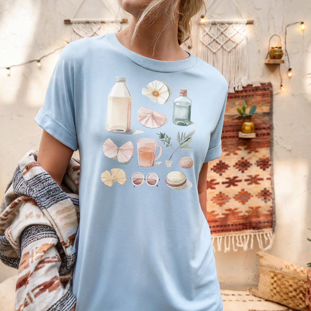 a woman wearing a blue shirt with shells on it