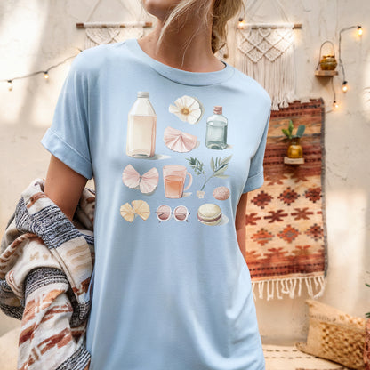 a woman wearing a blue shirt with shells on it