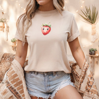 a woman wearing a strawberry t - shirt and denim shorts